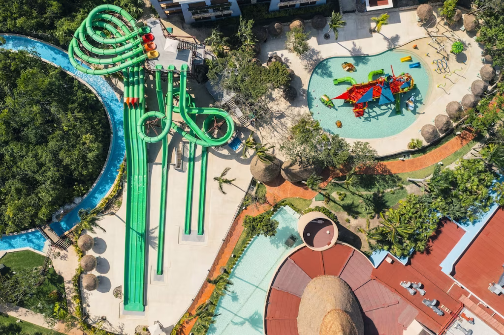 Waterslides and a smaller water play structure at one of the waterpark resorts in Cancun
