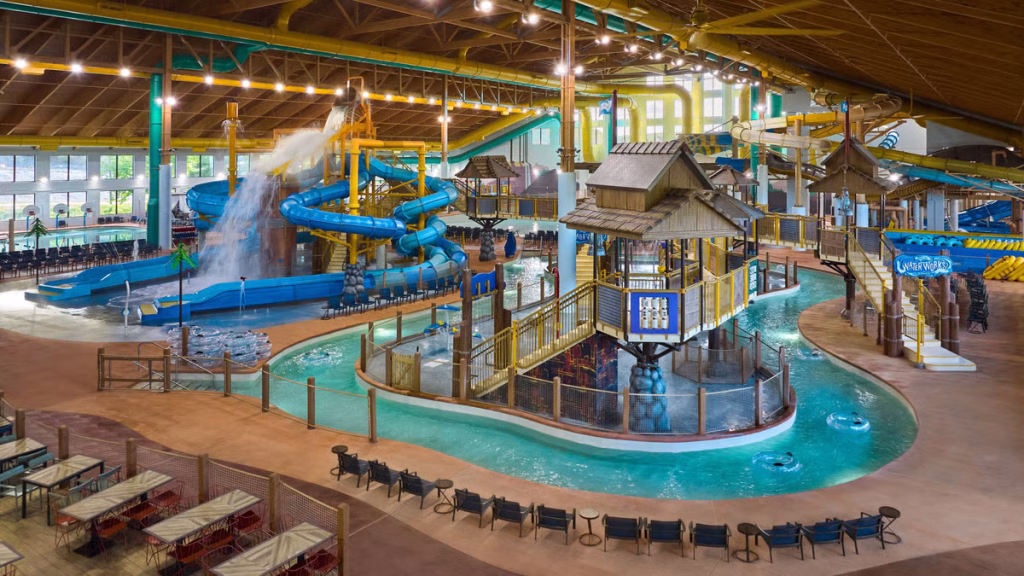 A large indoor waterpark with many slides and a lazy river at a family-friendly resort