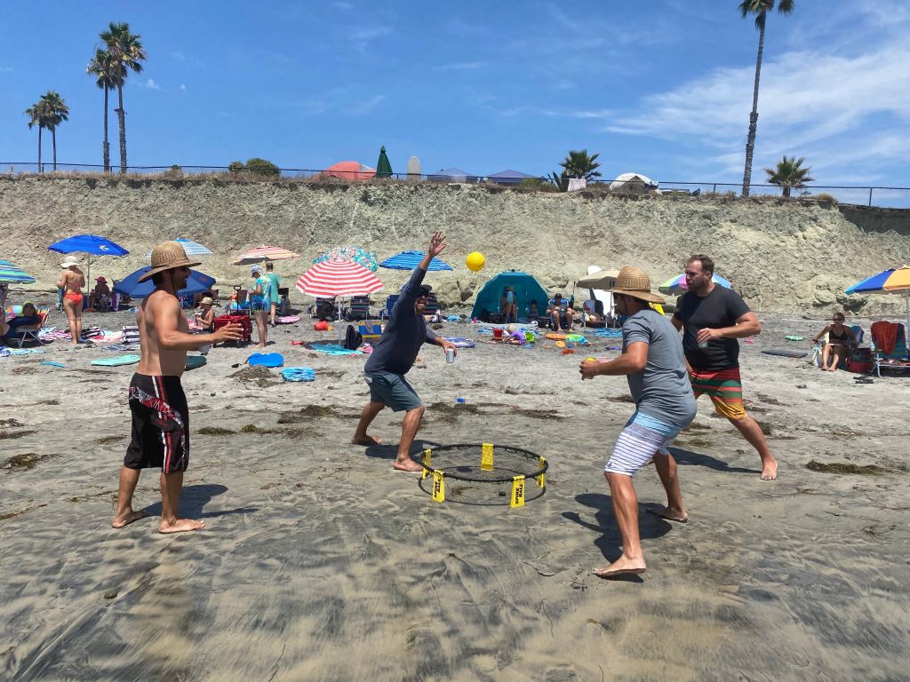 Spike Ball is one of the best beach games for families.