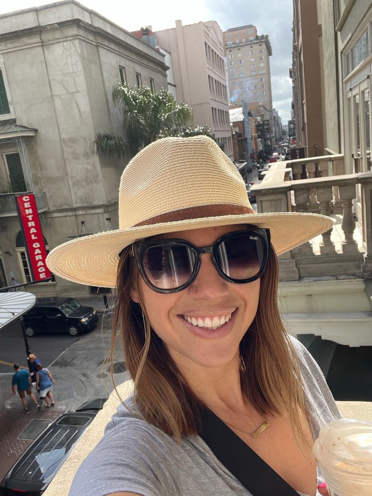 Enjoying our family vacation New Orleans with coffee on the hotel balcony.