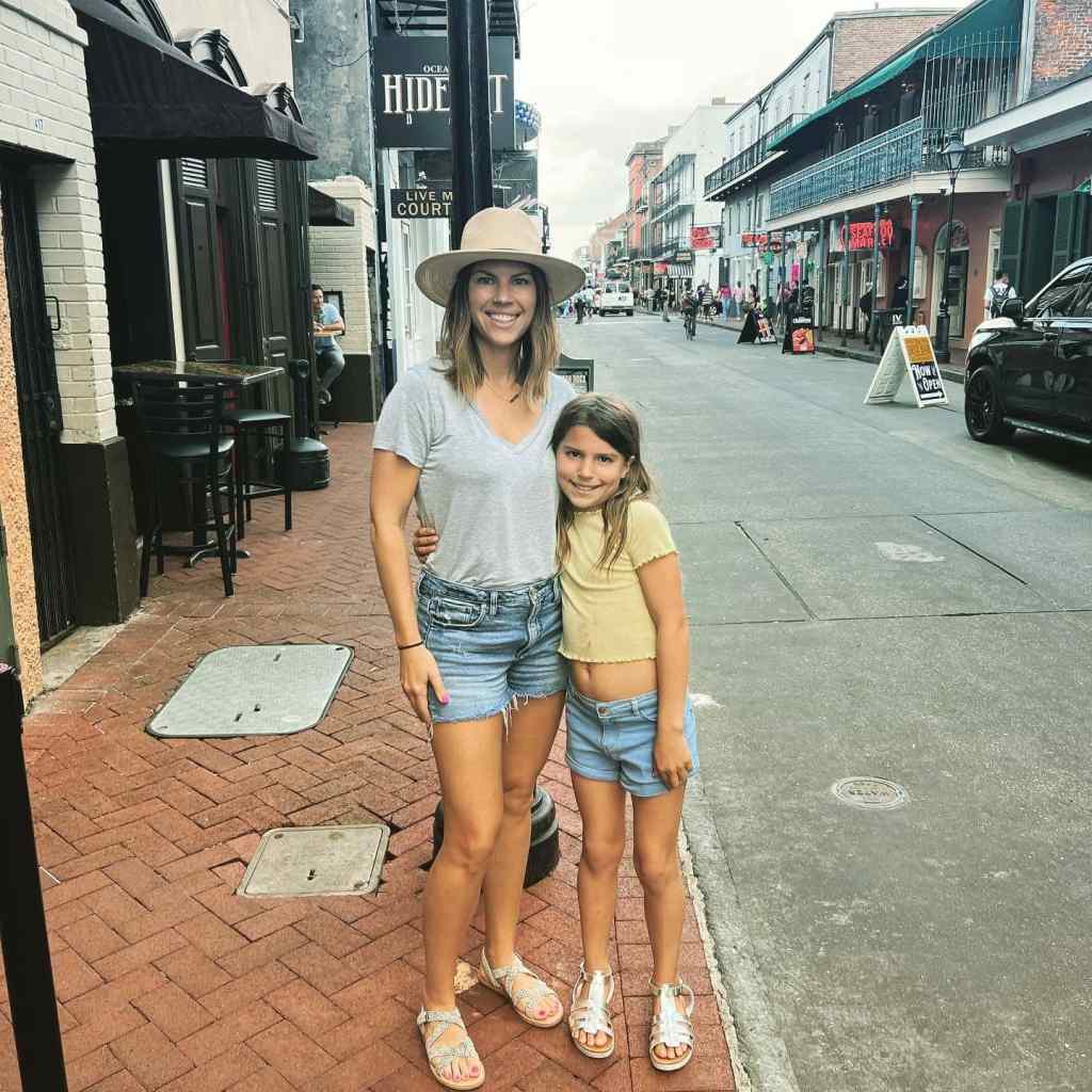 Posing on Bourbon St. during our family vacation New Orleans