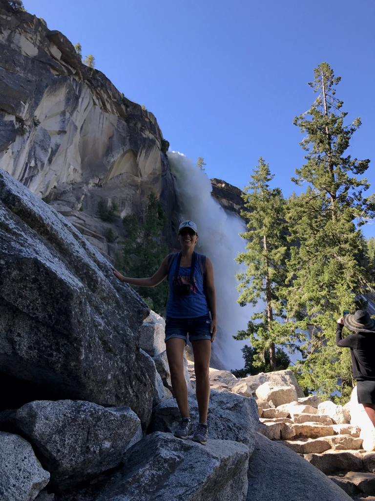 Standing with one of the waterfalls on the Panorama Trail in Yosemite
