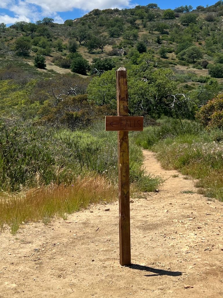 3 sisters falls trail sign pointing to the falls.