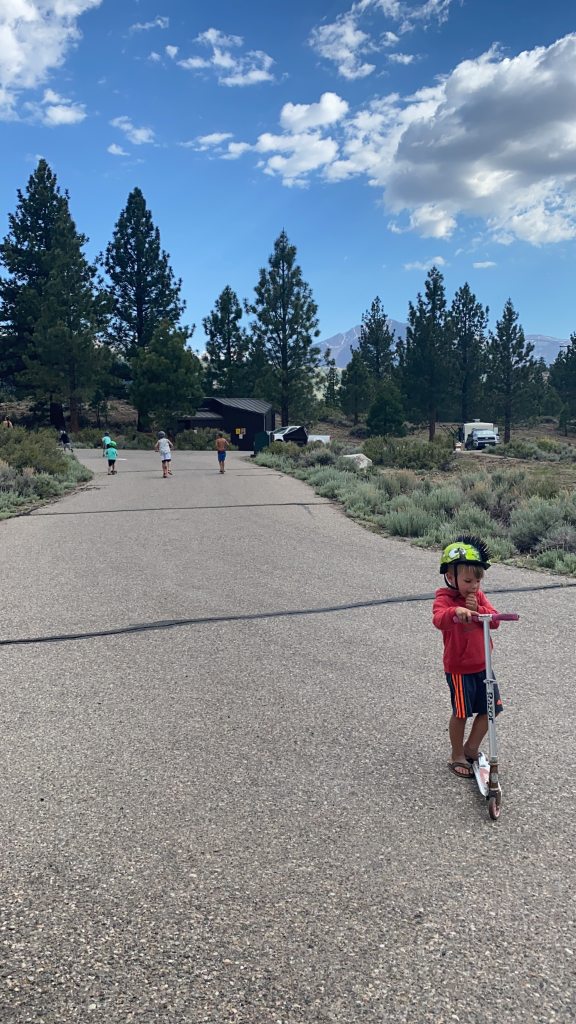 The kids on their scooters at the June Lake Oh Ridge Campground