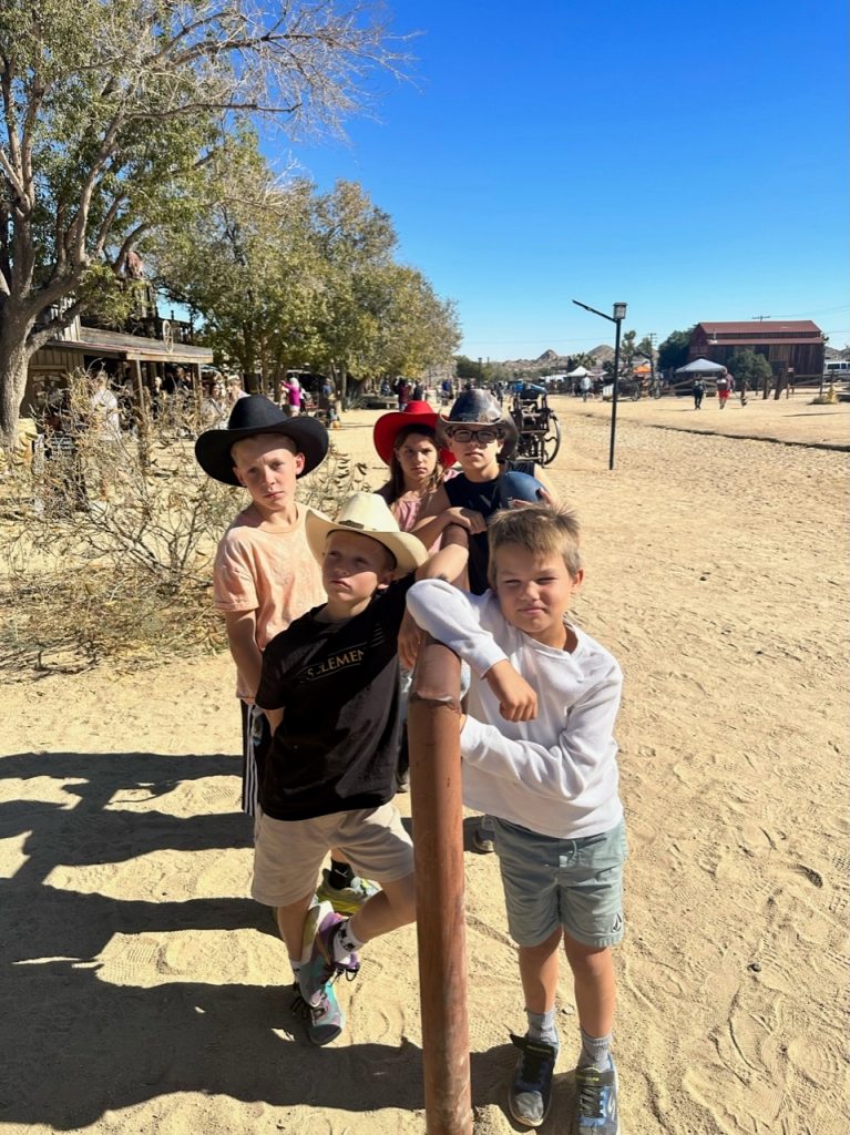 Working on their serious cowboy looks in Pioneertown Joshua Tree