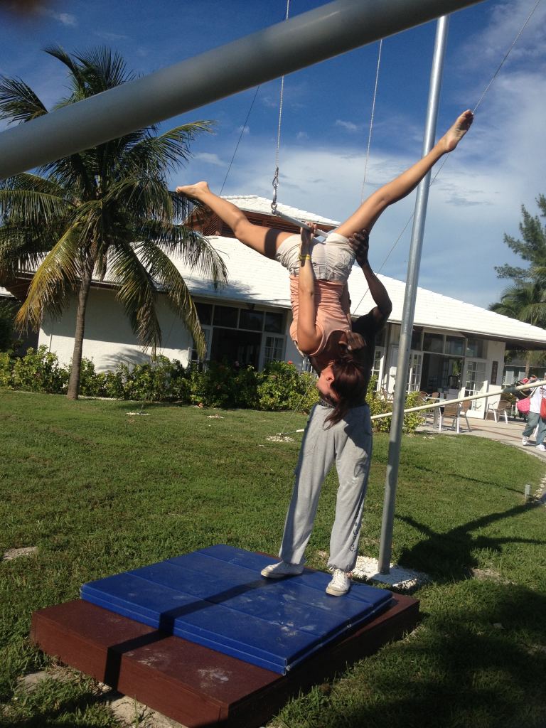 Practicing new skills on the trapeze at the Bahamas Wyndham Fortuna Beach