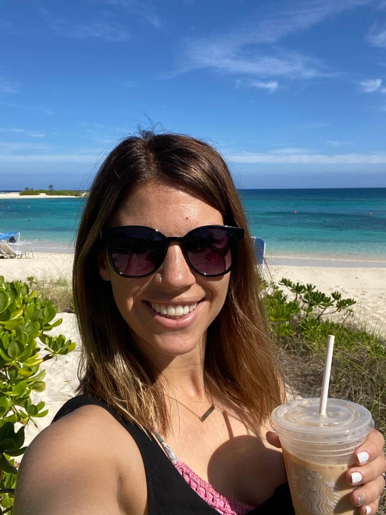 Enjoying my coffee at a gorgeous beach on our Bahamas family vacation