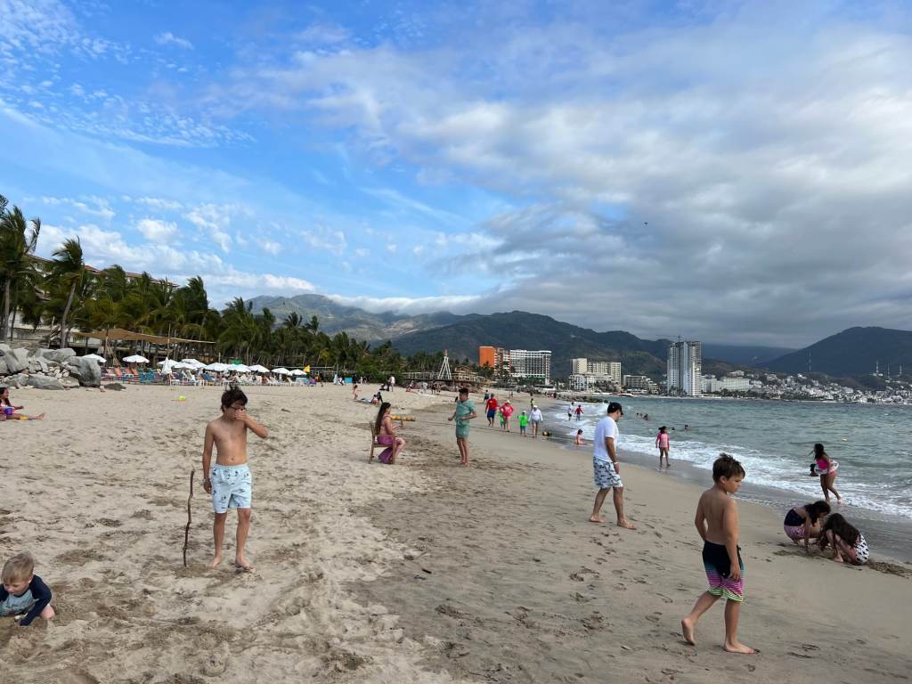 Enjoying the beach in front of a Puerto Vallarta family resort