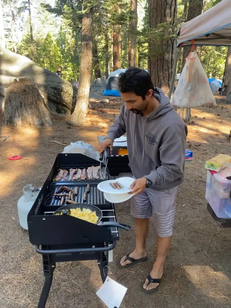 Making breakfast with our camping kitchen equipment