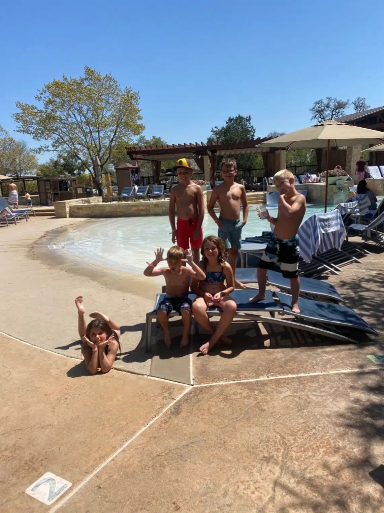 Kids posing at the pool at one of the best family resorts in Texas