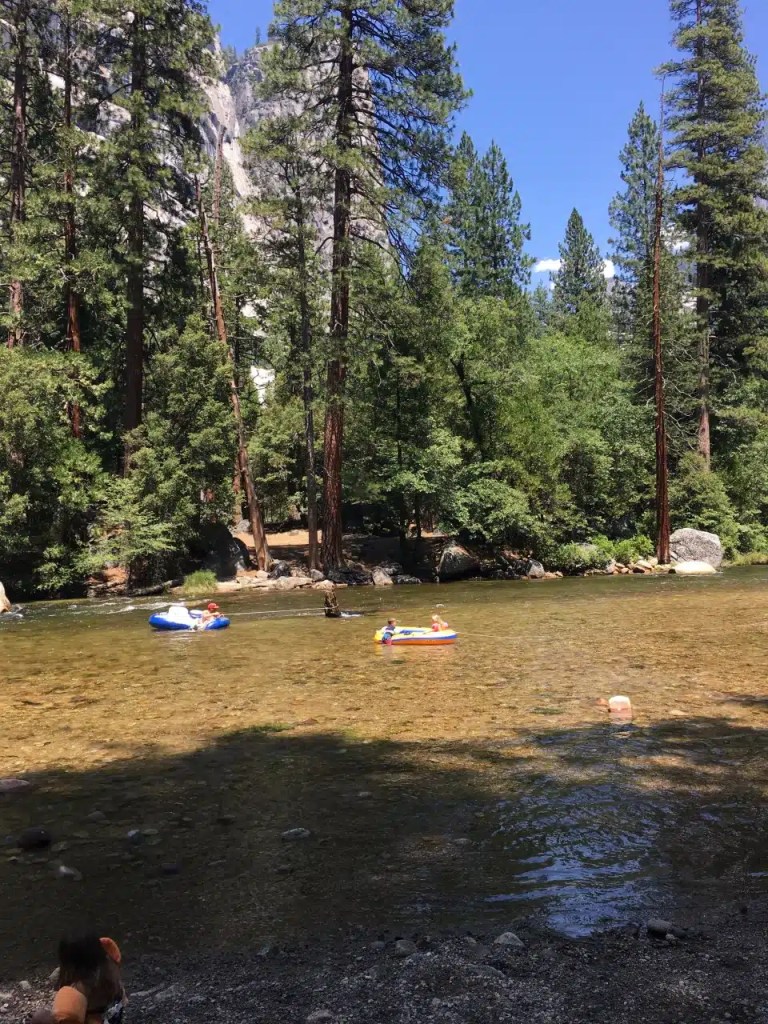 Two rafts on a river in a Yosemite Valley campground