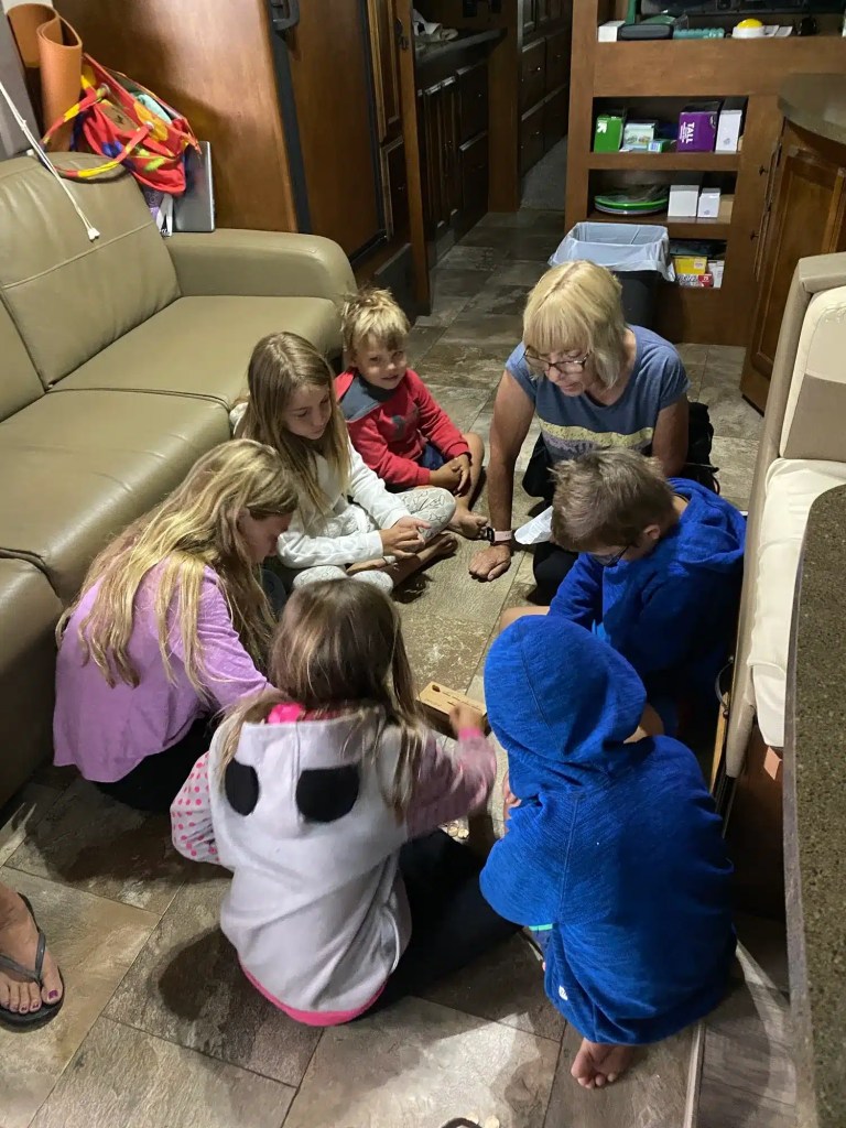Playing indoor games while camping in the rain