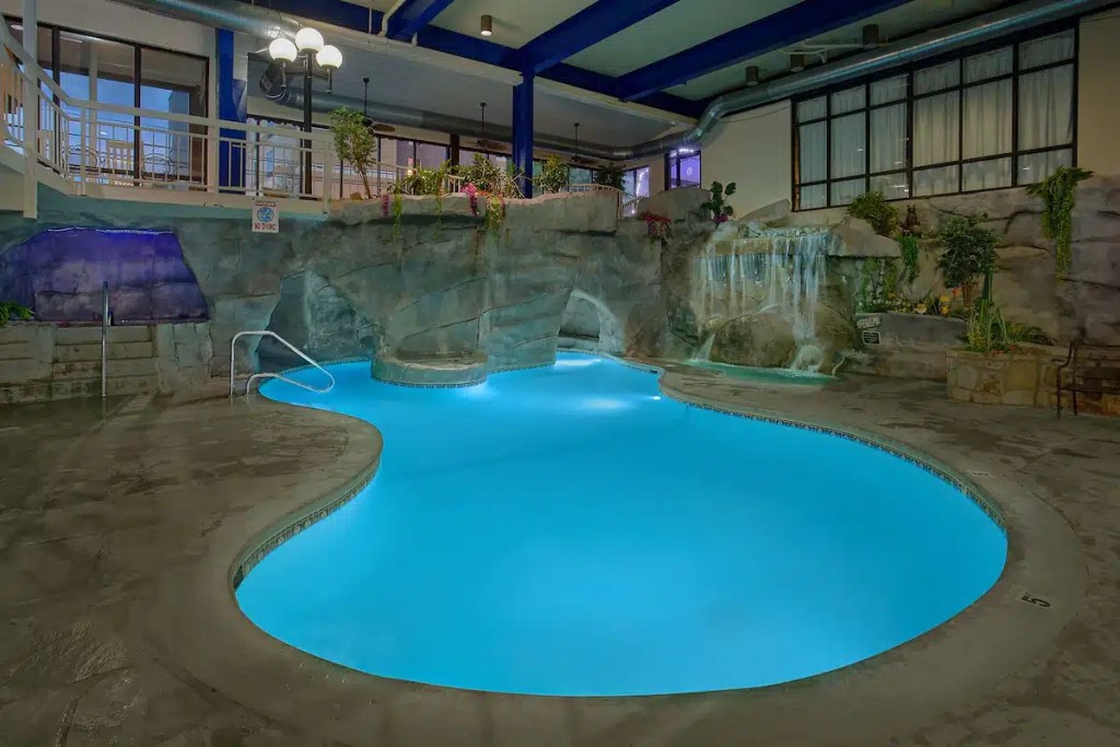 A Gatlinburg hotel with an indoor pool and grotto with waterfall.