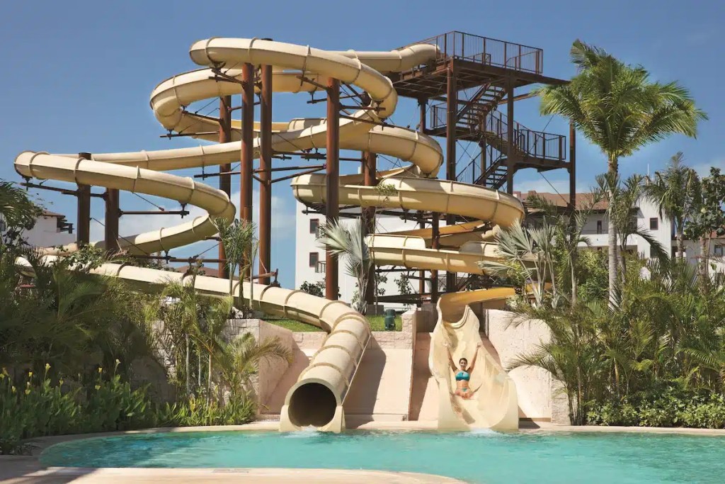 Two twisting waterslides at one of the Cancun resorts with waterparks