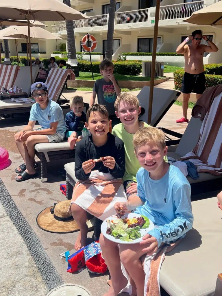 Kids eating and smiling at one of the cheapest all inclusive resorts in Puerto Vallarta