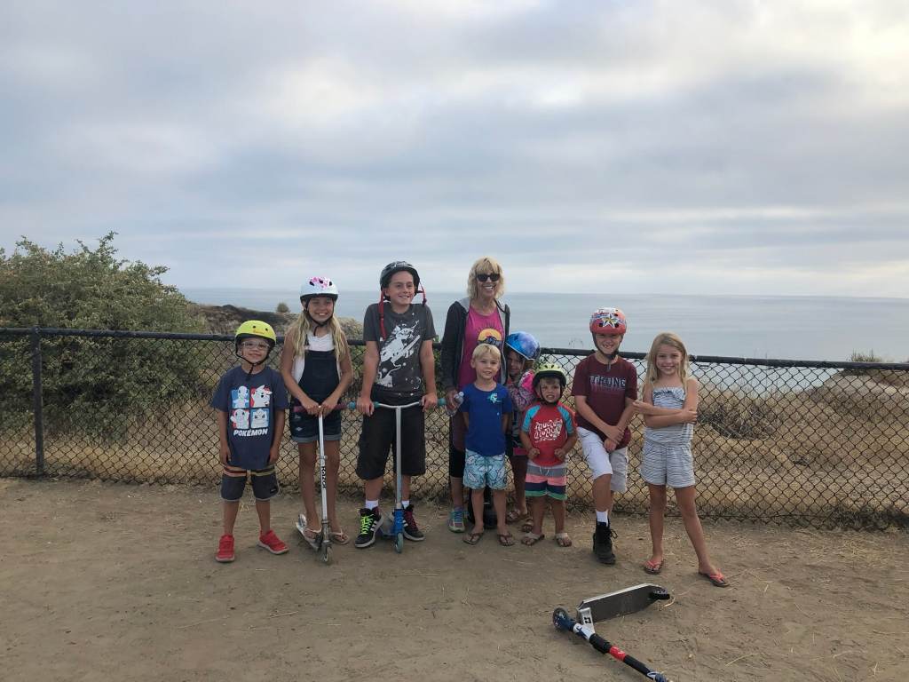 Nine people taking a picture at the San Clemente State Beach campground
