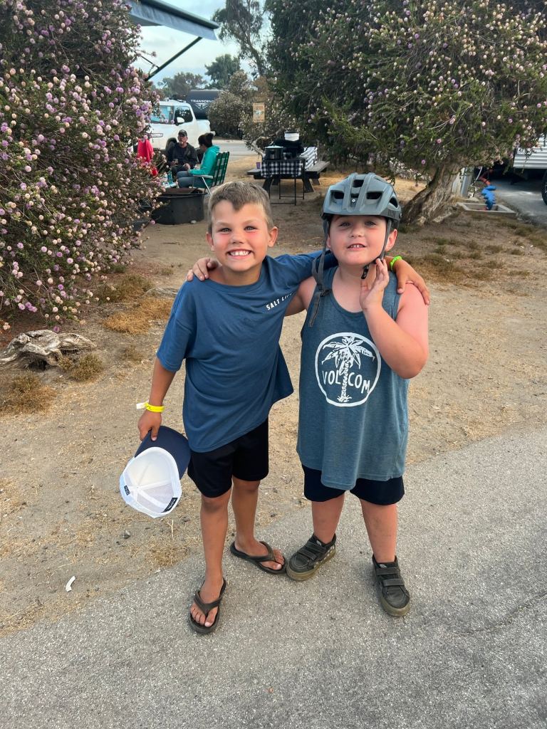 Two smiling boys at the San Clemente beach campground