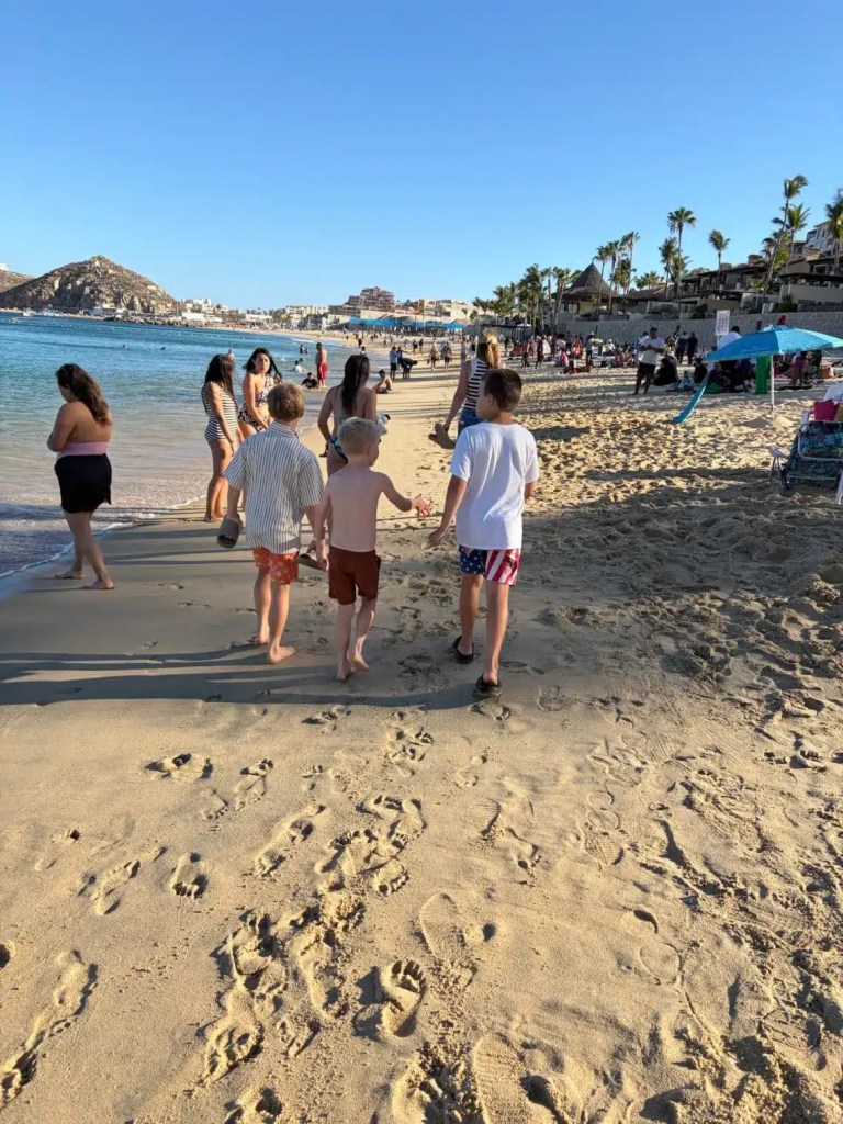 Kids on the beach while on a Cabo family vacation