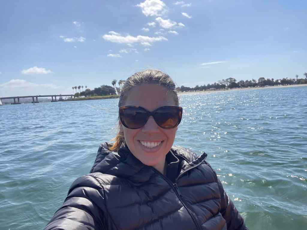 A woman kayaking in San Diego, which is one of the best places to visit in February