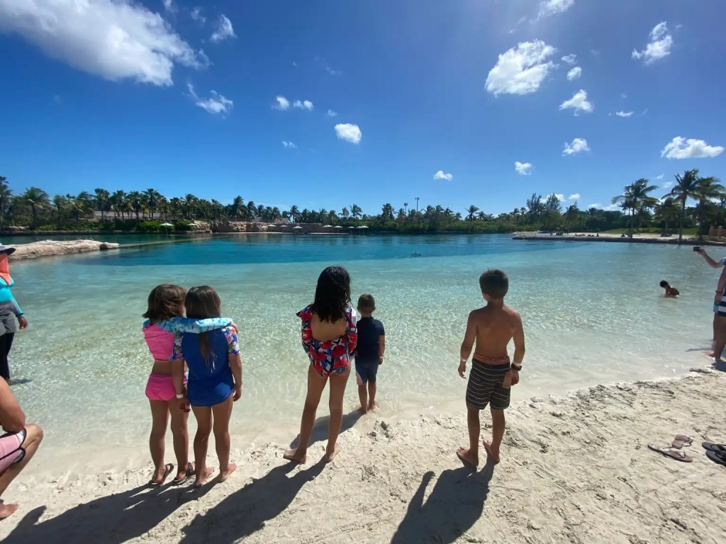 Kids and blue waters on one of the best Bahamas Islands for families