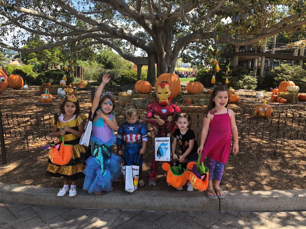 A group of kids in costumes at Sea World's Spooktacular Halloween event