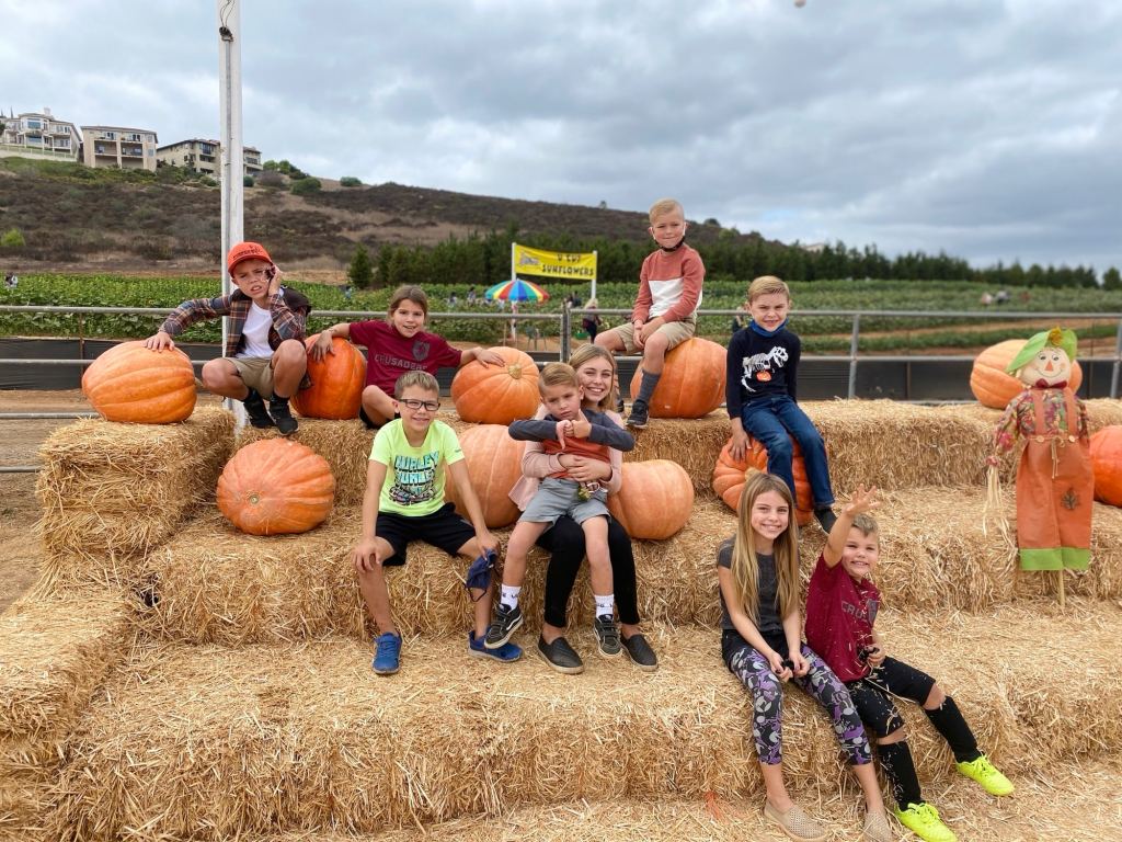 Kids at a pumpkin patch in San Diego, which is a great city to visit in October