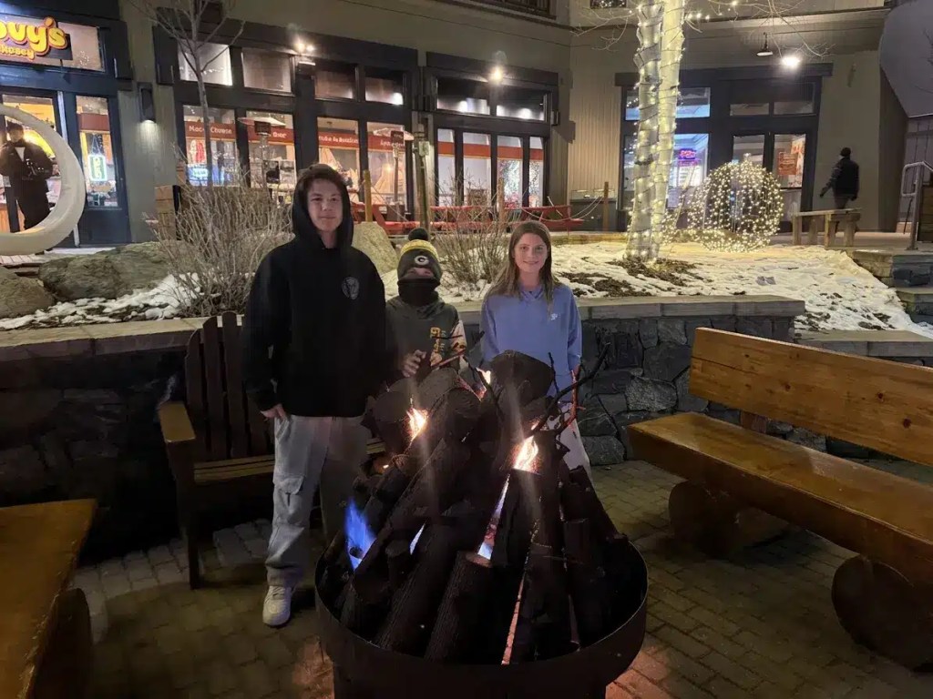 img_1589 Three kids enjoying a fire while on an inexpensive cold weather winter vacation