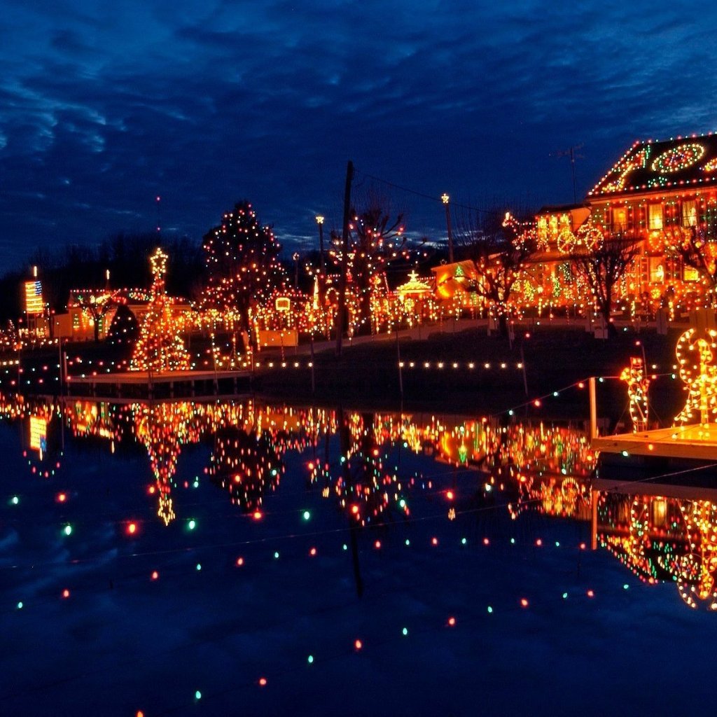 Christmas lights reflecting on water in one of the top Christmas holiday vacation destinations